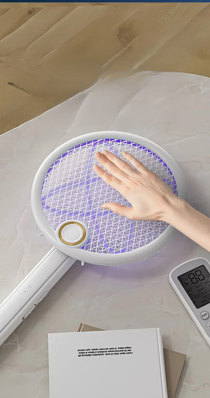 Racket kills flies and mosquitoes